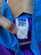 Close-up of a blue jacket with a visible brand label.